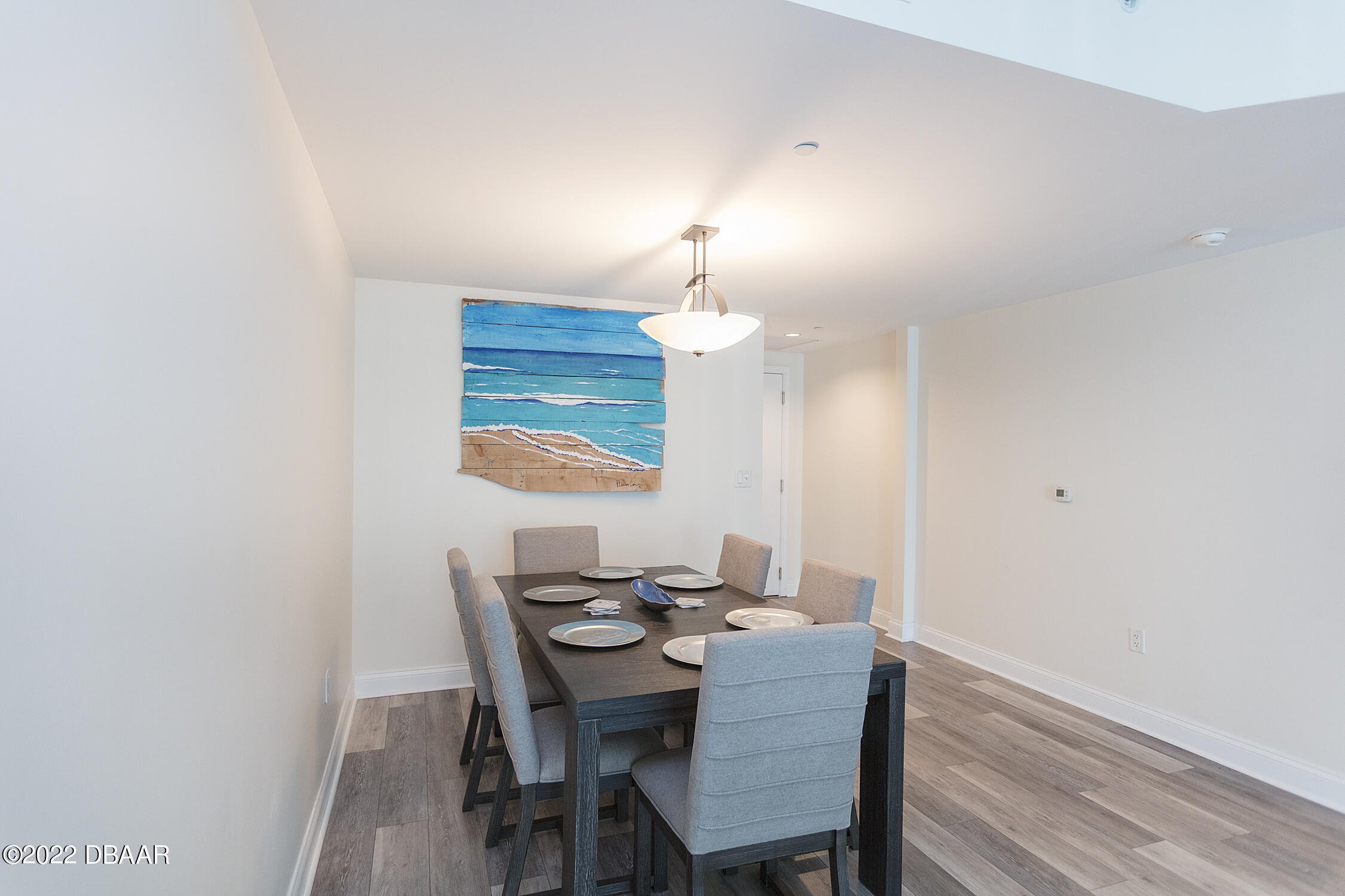 231 Riverside Drive, Unit 11061 Holly Hill, FL 32117 - Photo 13 of 64 a view of a dining room with furniture and wooden floor