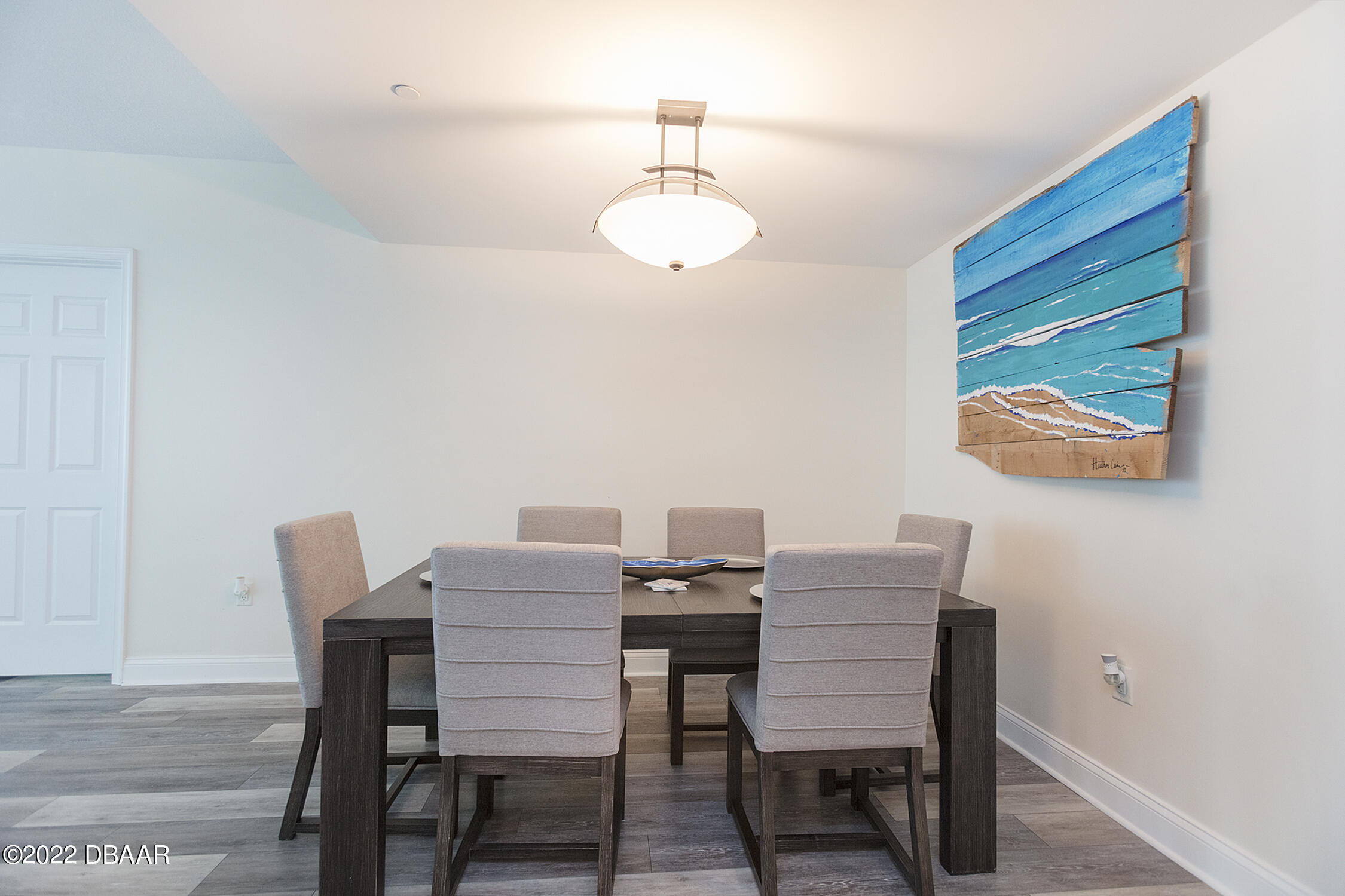 231 Riverside Drive, Unit 11061 Holly Hill, FL 32117 - Photo 14 of 64 a view of a dining room with furniture and wooden floor
