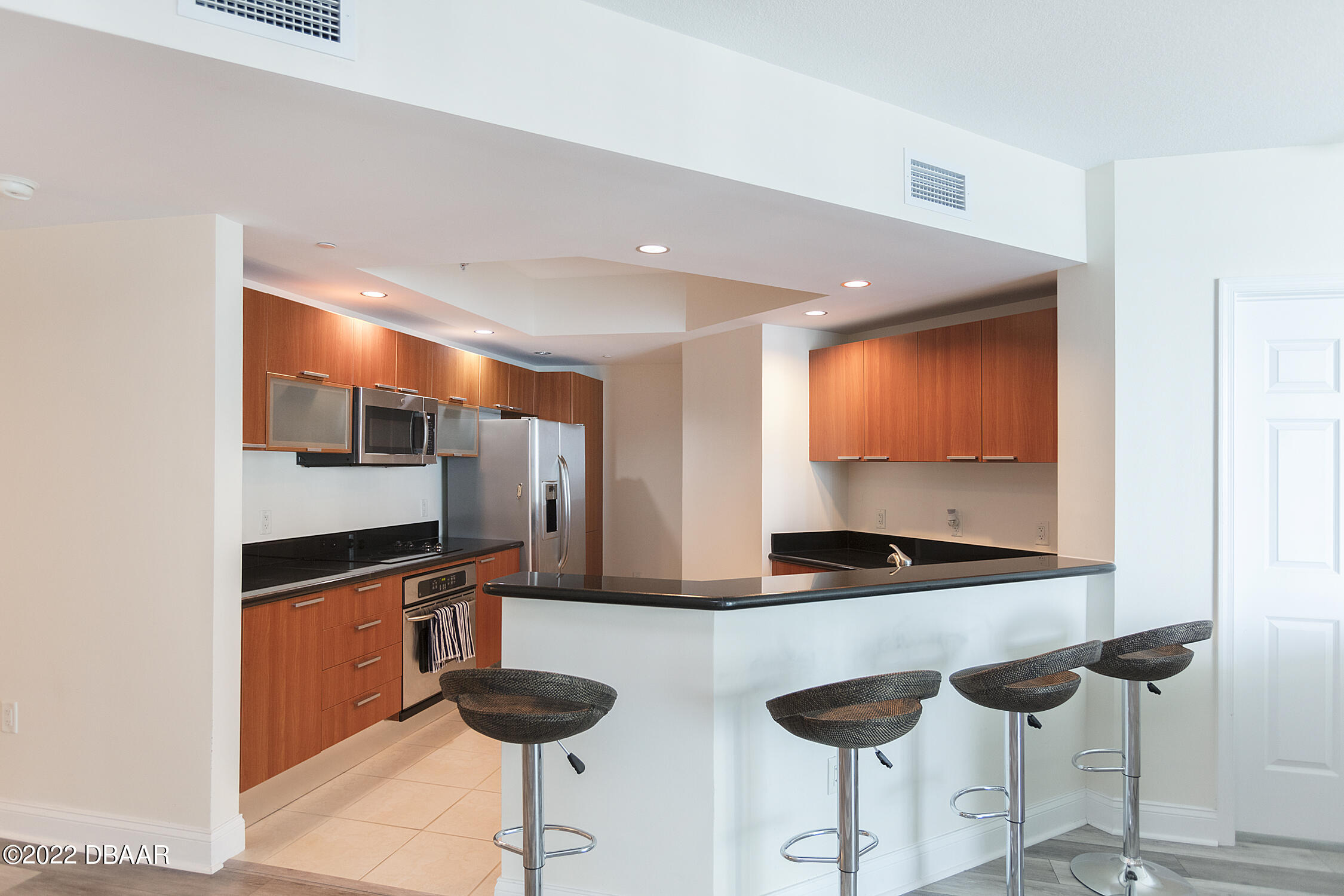 231 Riverside Drive, Unit 11061 Holly Hill, FL 32117 - Photo 15 of 64 a room with lots of chairs and mirrors