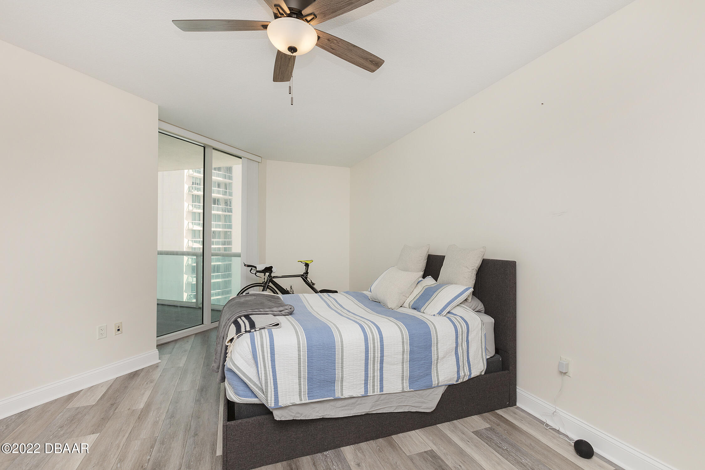 231 Riverside Drive, Unit 11061 Holly Hill, FL 32117 - Photo 23 of 64 a bedroom with a bed and a window