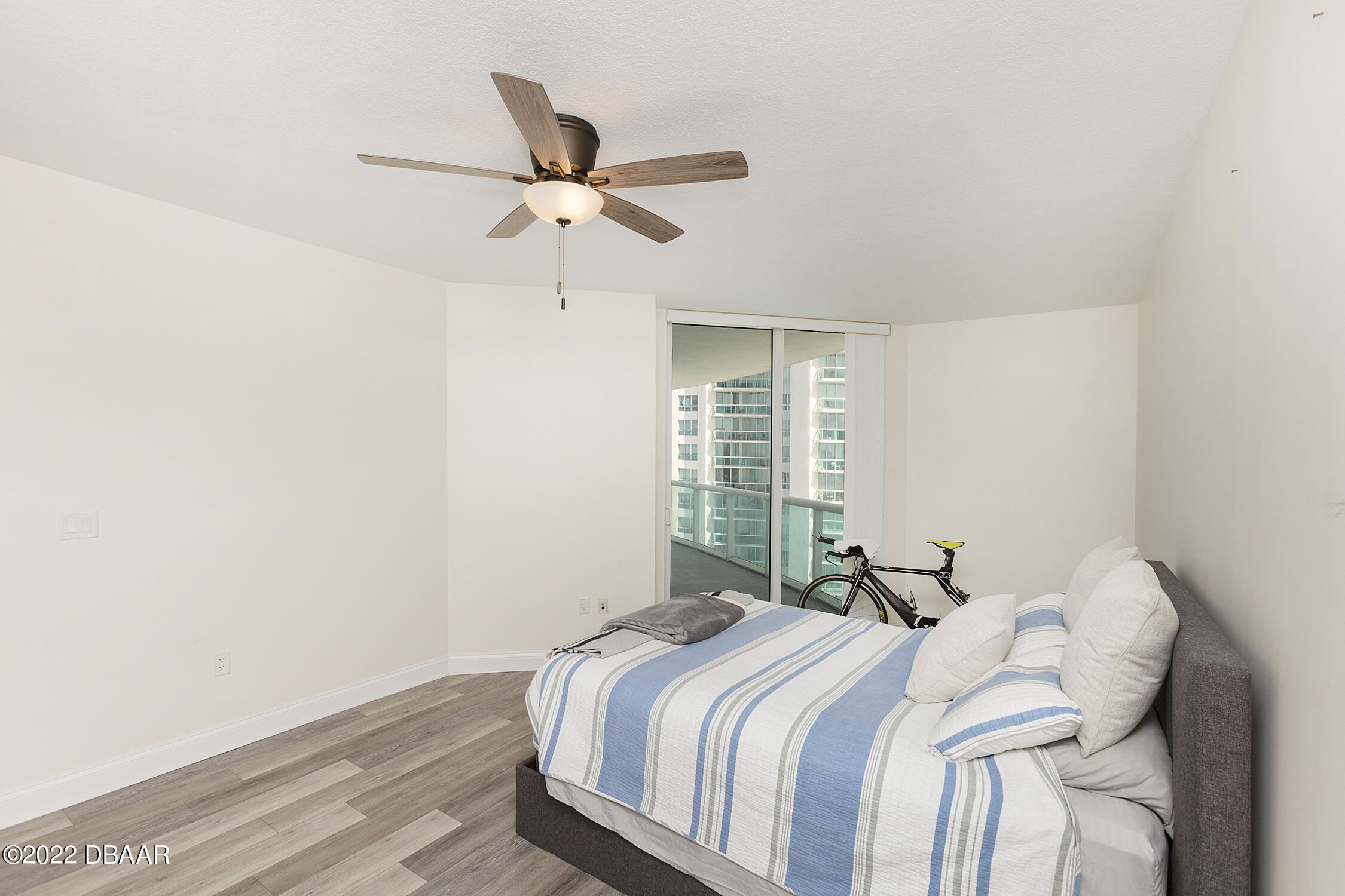 231 Riverside Drive, Unit 11061 Holly Hill, FL 32117 - Photo 24 of 64 a bedroom with a bed and a window