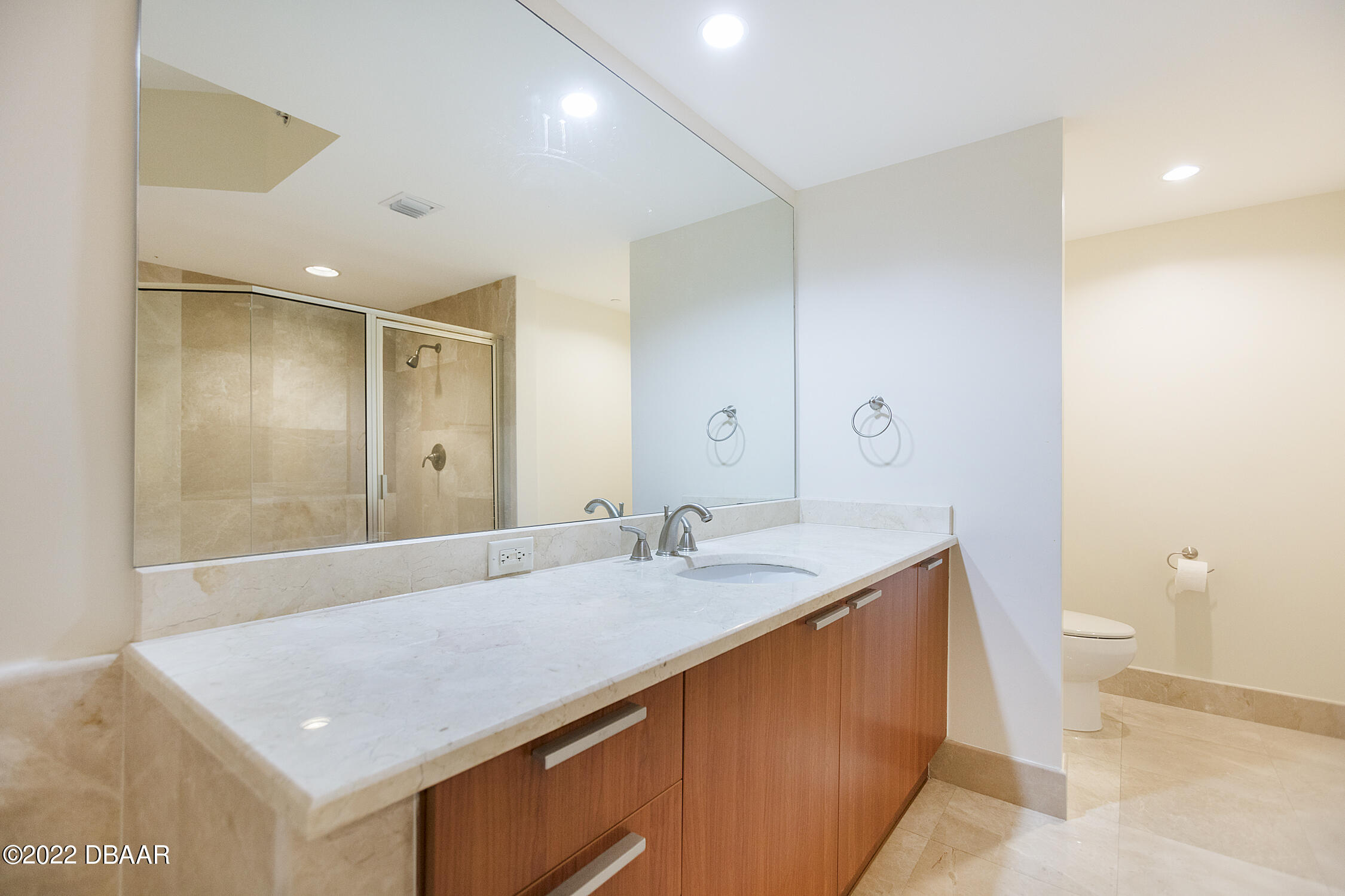 231 Riverside Drive, Unit 11061 Holly Hill, FL 32117 - Photo 26 of 64 a bathroom with a granite countertop sink and a mirror