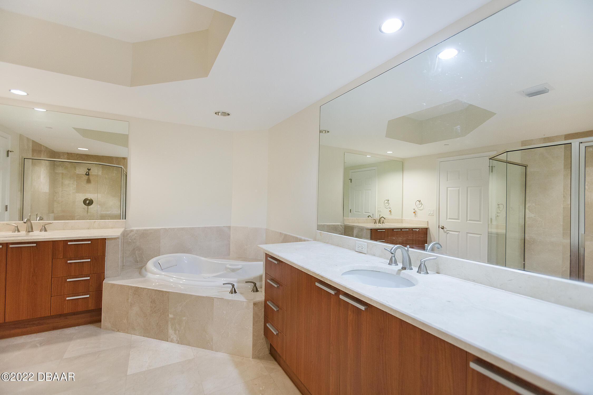 231 Riverside Drive, Unit 11061 Holly Hill, FL 32117 - Photo 27 of 64 a bathroom with a sink double vanity granite tub shower and a mirror
