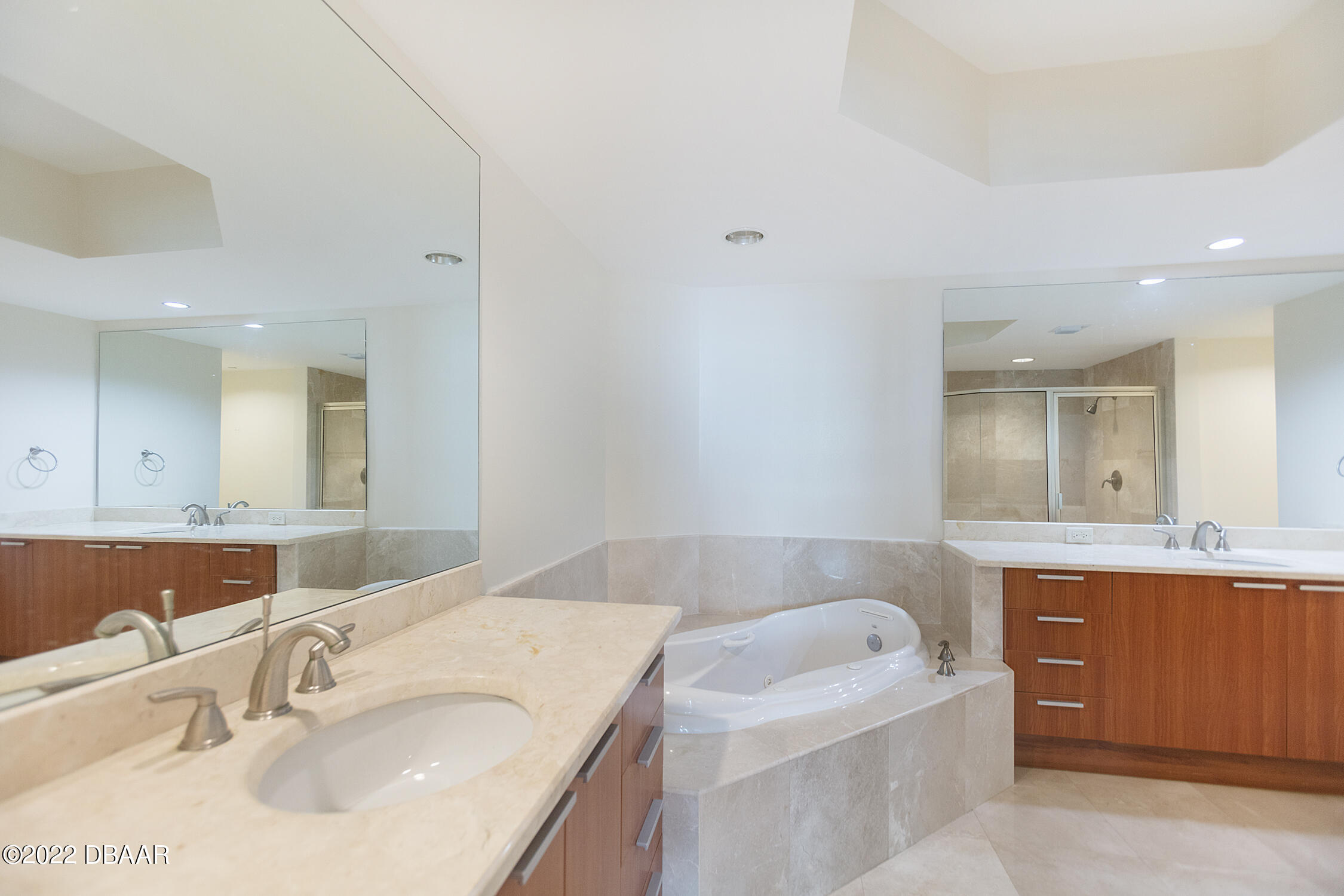 231 Riverside Drive, Unit 11061 Holly Hill, FL 32117 - Photo 30 of 64 a bathroom with a bathtub sink and mirror