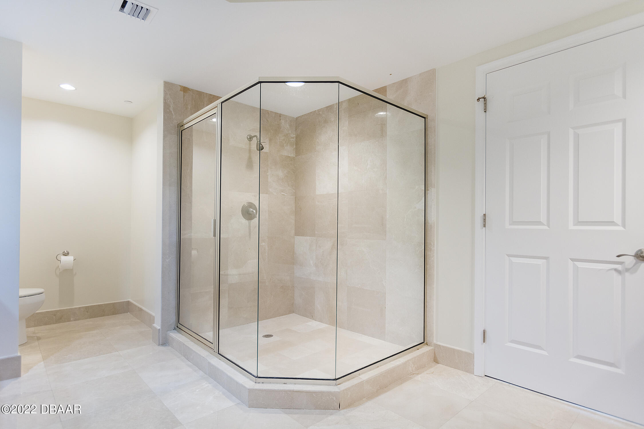 231 Riverside Drive, Unit 11061 Holly Hill, FL 32117 - Photo 33 of 64 a bathroom with a glass shower door