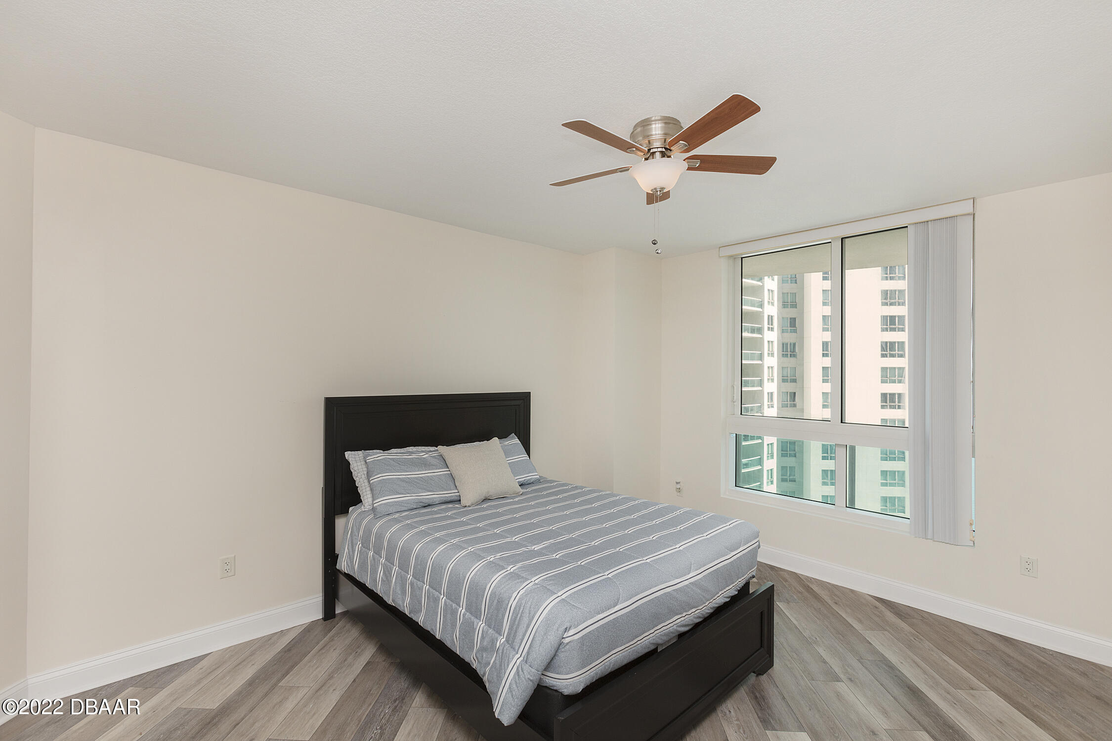 231 Riverside Drive, Unit 11061 Holly Hill, FL 32117 - Photo 34 of 64 a bedroom with a large bed and a window