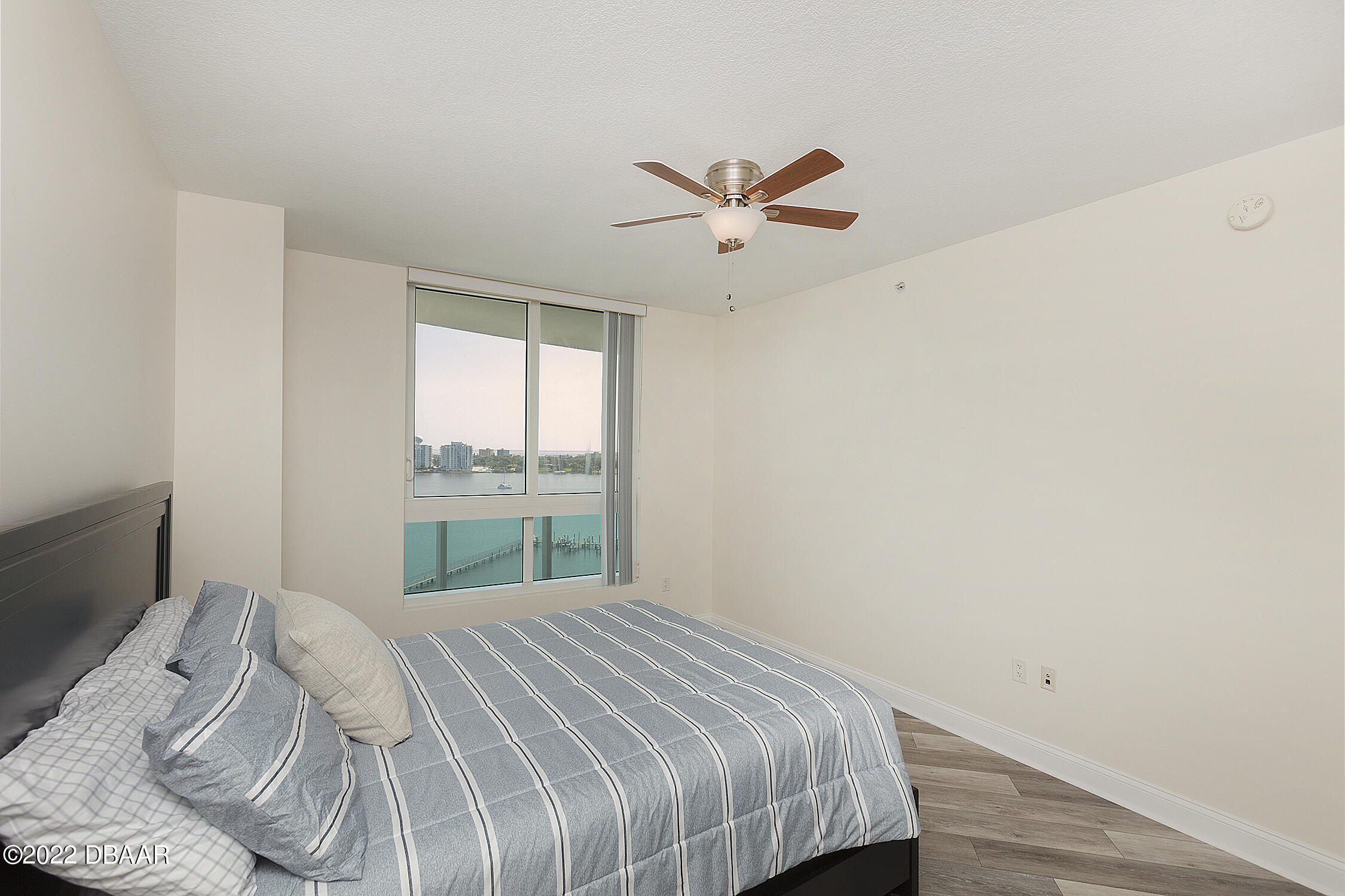 231 Riverside Drive, Unit 11061 Holly Hill, FL 32117 - Photo 35 of 64 a bedroom with a bed and window