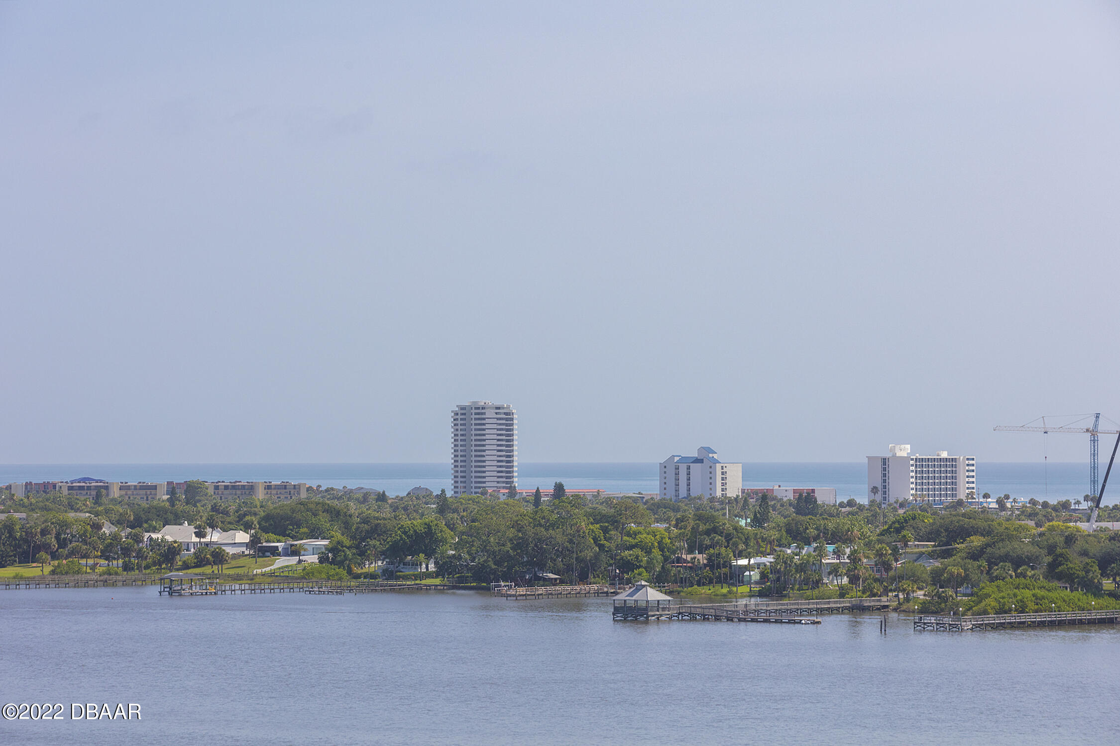 231 Riverside Drive, Unit 11061 Holly Hill, FL 32117 - Photo 4 of 64 a view of a city with tall buildings in the background