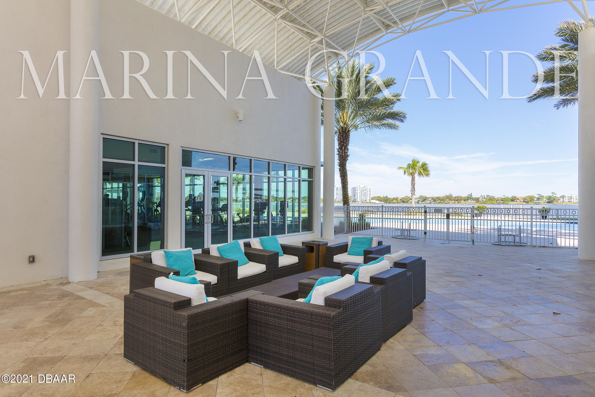 231 Riverside Drive, Unit 11061 Holly Hill, FL 32117 - Photo 57 of 64 a living room with furniture tv and floor to ceiling windows