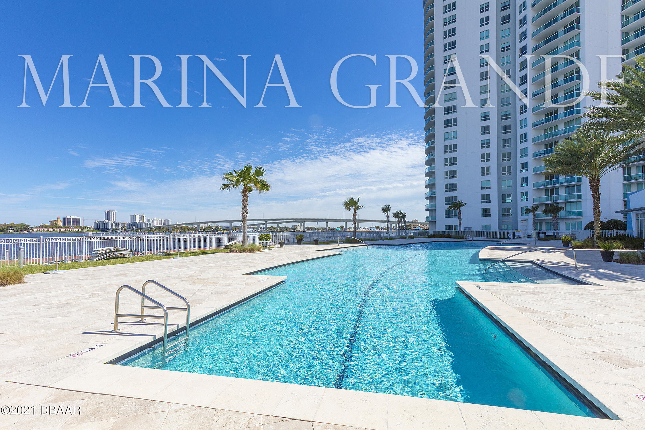 231 Riverside Drive, Unit 11061 Holly Hill, FL 32117 - Photo 58 of 64 a view of a swimming pool with a bench and lake view