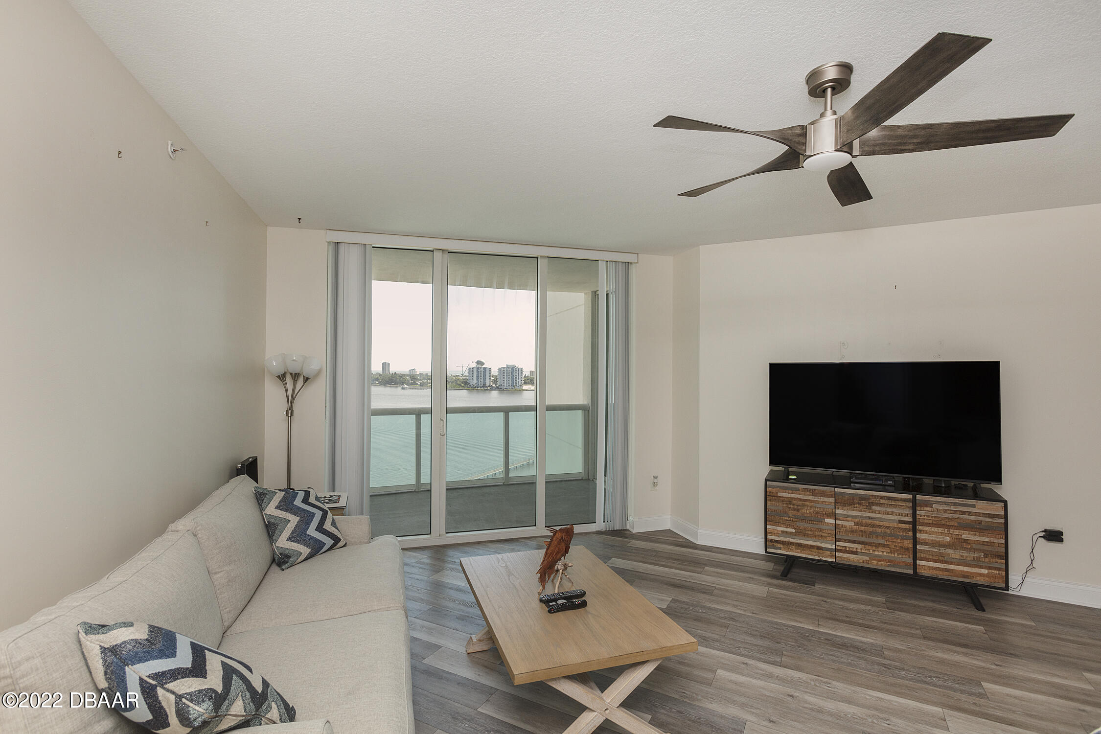 231 Riverside Drive, Unit 11061 Holly Hill, FL 32117 - Photo 8 of 64 a living room with furniture and a flat screen tv