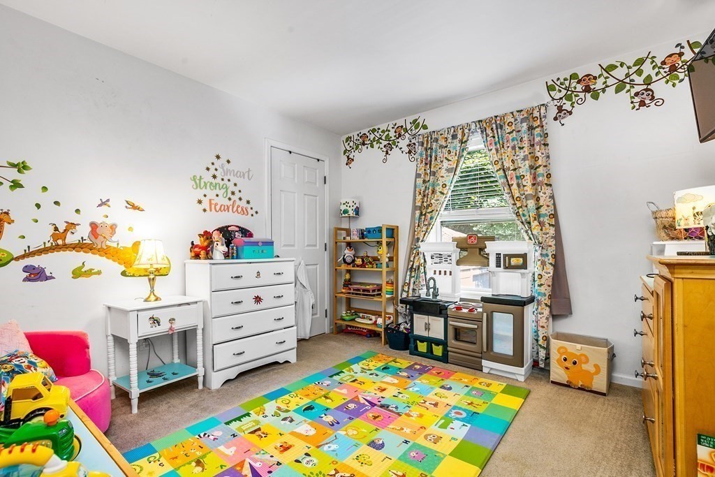 111 Wompatuck Road Hingham, MA 02043 - Photo 11 of 33 a bed room with a bed and a baby crib