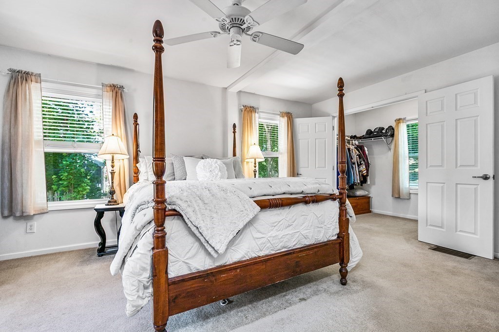 111 Wompatuck Road Hingham, MA 02043 - Photo 14 of 33 a bedroom with a bed window and walk in closet with window