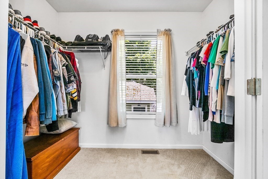 111 Wompatuck Road Hingham, MA 02043 - Photo 16 of 33 a view of walk in closet with clothes and shoes