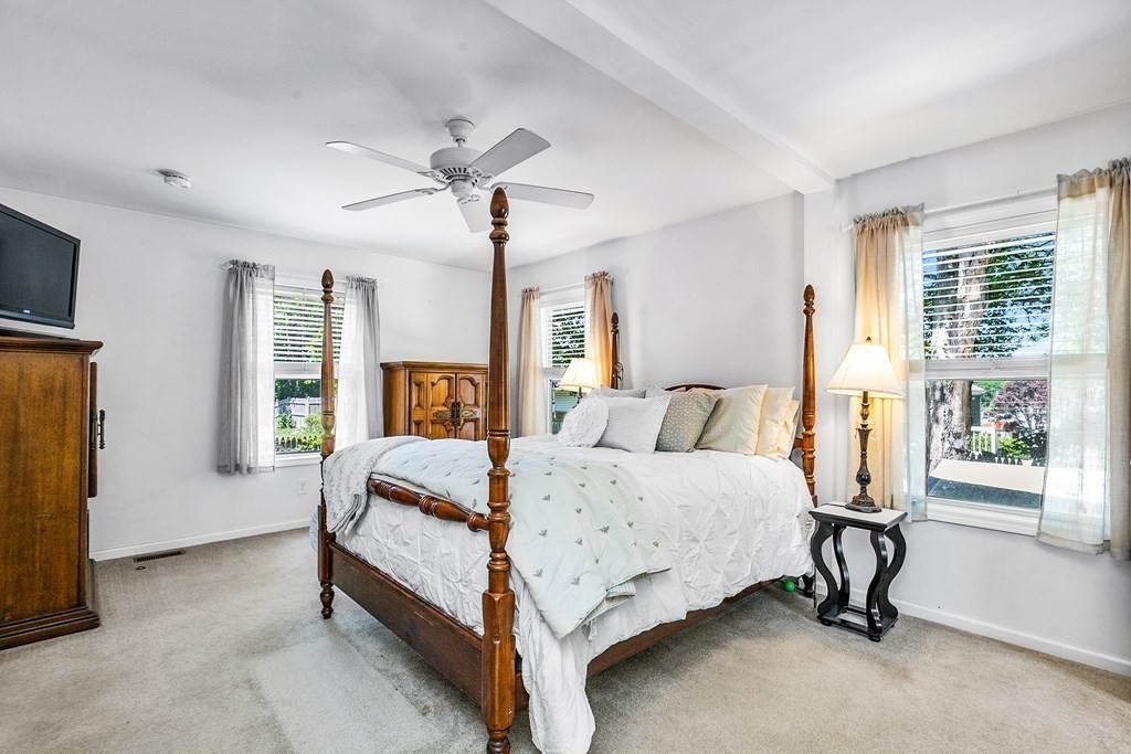111 Wompatuck Road Hingham, MA 02043 - Photo 17 of 33 a spacious bedroom with a bed and a window