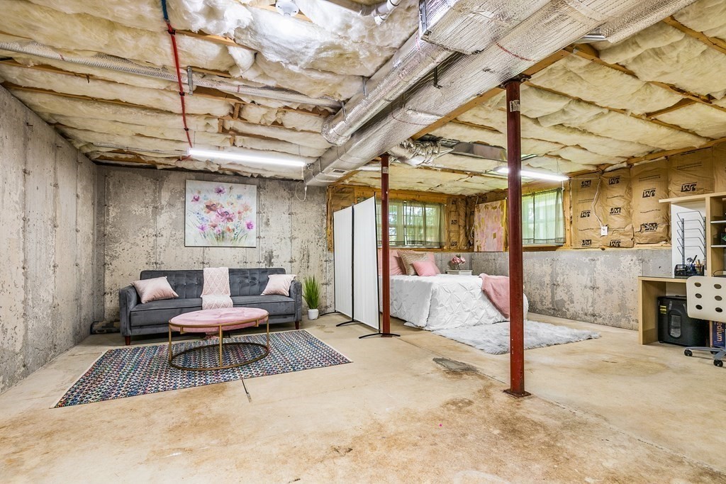111 Wompatuck Road Hingham, MA 02043 - Photo 20 of 33 a living room with furniture and a chandelier