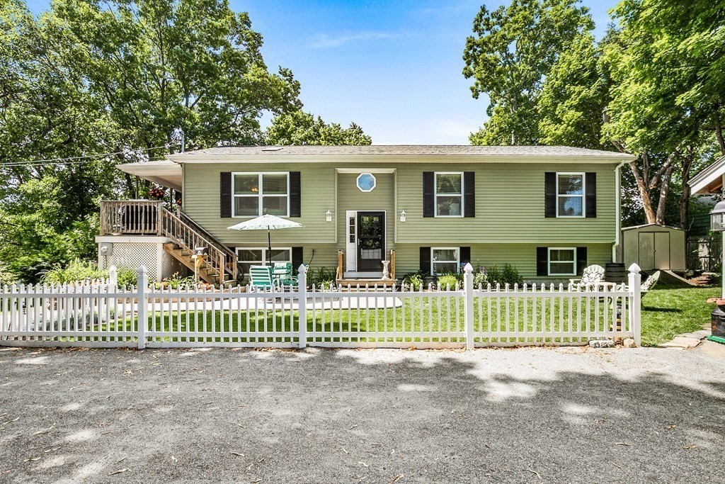 111 Wompatuck Road Hingham, MA 02043 - Photo 2 of 33 a front view of a house with a garden
