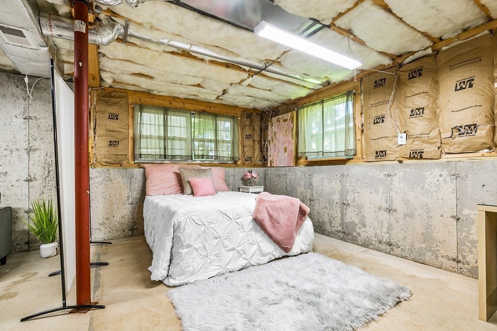 111 Wompatuck Road Hingham, MA 02043 - Photo 21 of 33 a large bed sitting in a bedroom next to a window