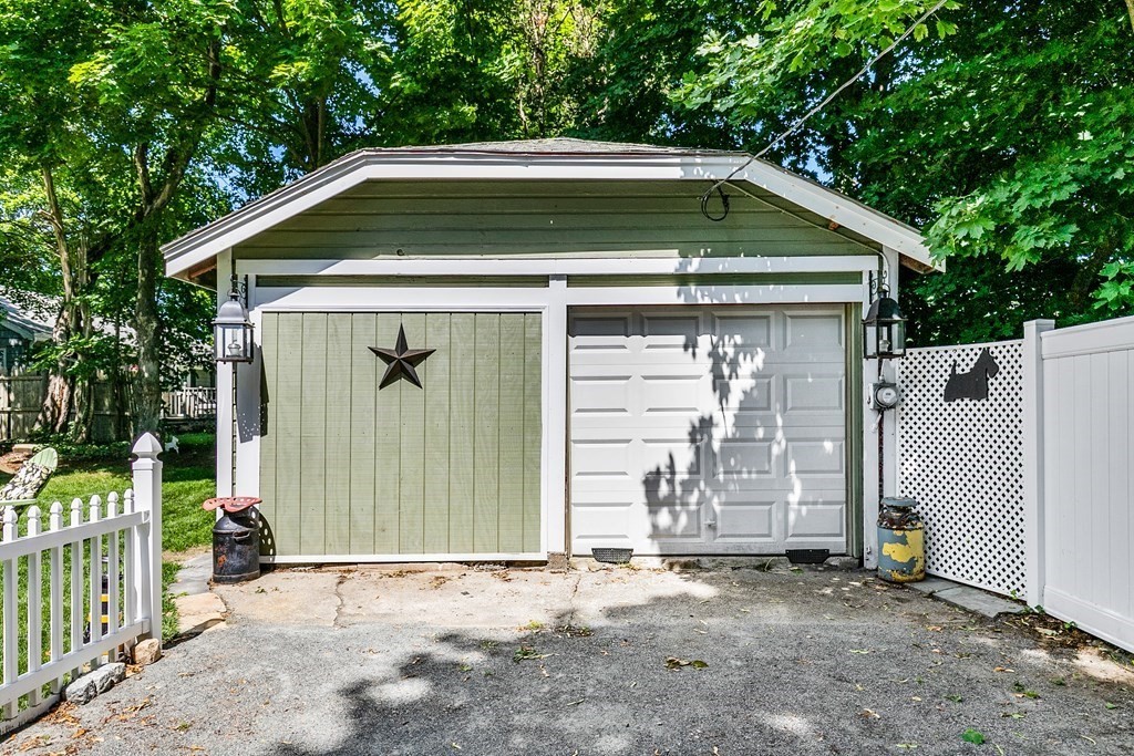 111 Wompatuck Road Hingham, MA 02043 - Photo 22 of 33 a front view of a house with garage