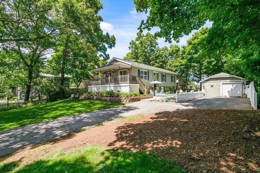 111 Wompatuck Road Hingham, MA 02043 - Photo 6 of 33 a view of a house with a yard and large trees