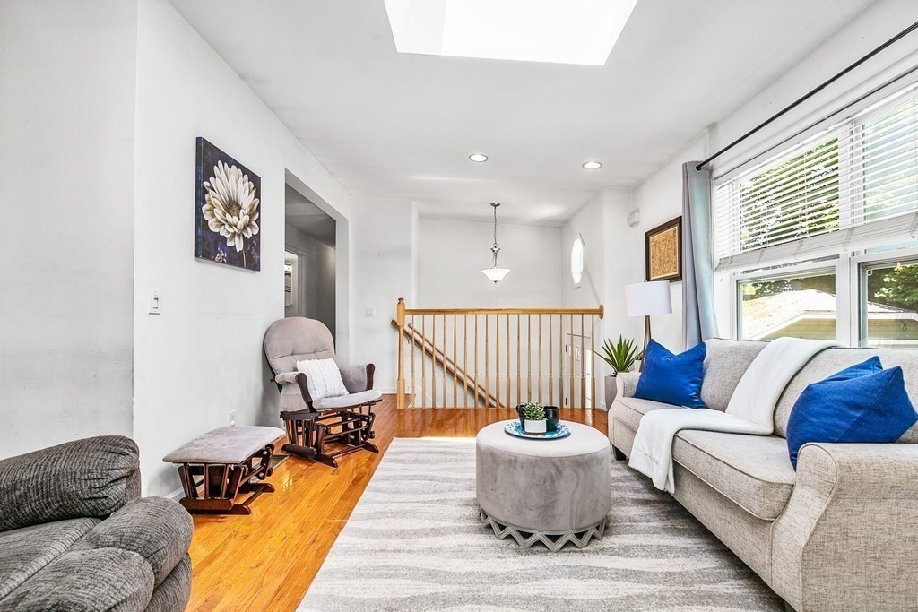 111 Wompatuck Road Hingham, MA 02043 - Photo 7 of 33 a living room with furniture and a large window