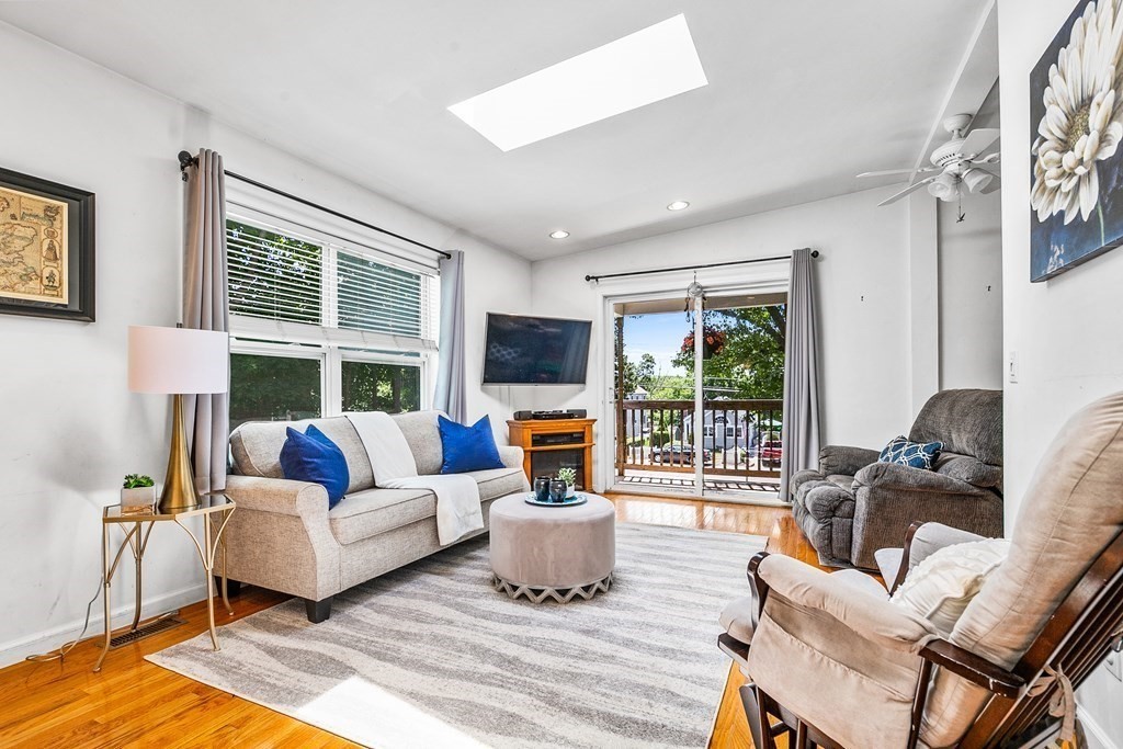 111 Wompatuck Road Hingham, MA 02043 - Photo 9 of 33 a living room with furniture fireplace and flat screen tv