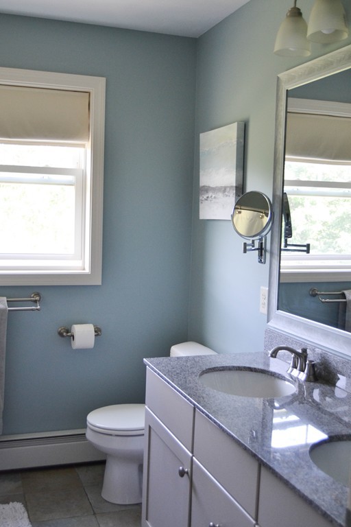 89 Davis Road Westminster, MA 01473 - Photo 15 of 25 a bathroom with a granite countertop toilet sink and mirror