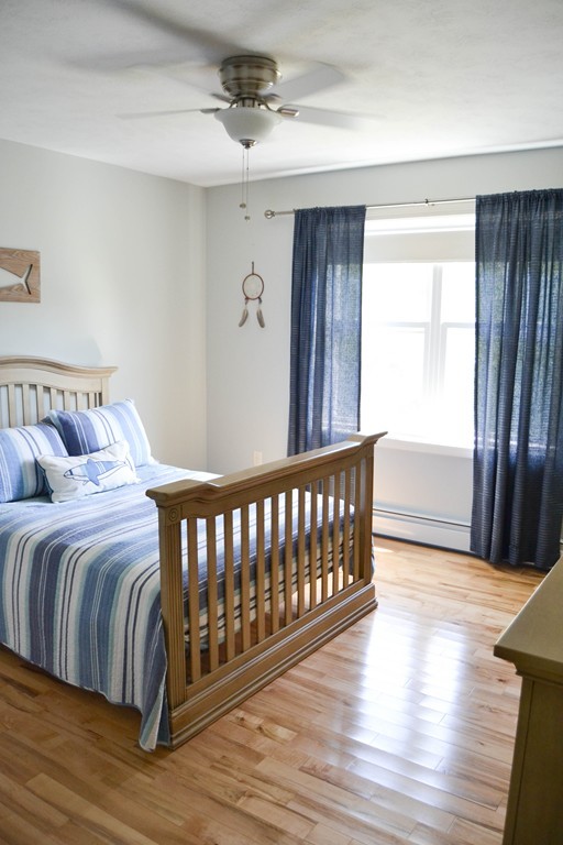 89 Davis Road Westminster, MA 01473 - Photo 18 of 25 a bedroom with two beds and wooden floor