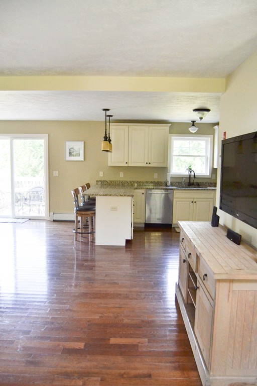 89 Davis Road Westminster, MA 01473 - Photo 3 of 25 a kitchen with a sink stove top oven and cabinets