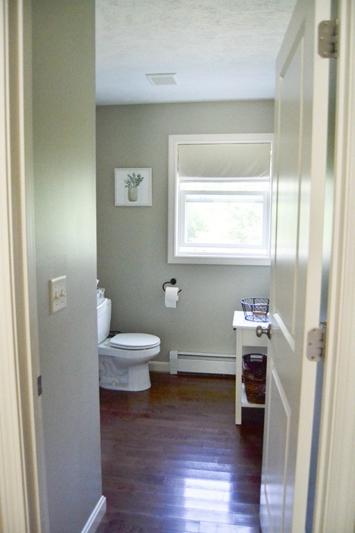 89 Davis Road Westminster, MA 01473 - Photo 8 of 25 a bathroom with a sink toilet and a window