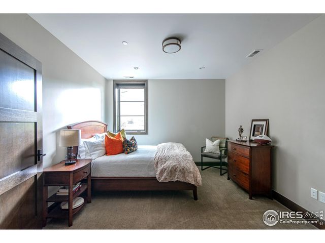 a bedroom with bed and a window