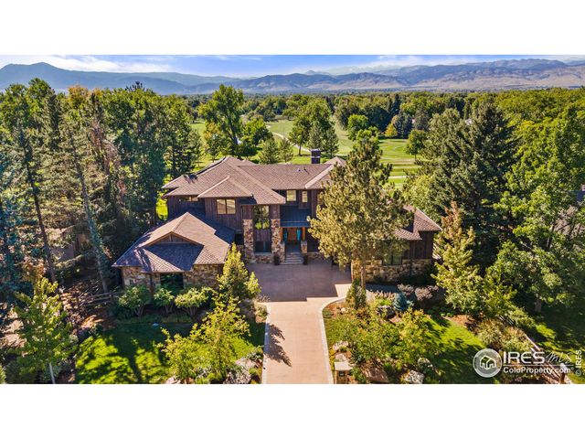 a view of a garden with an outdoor seating