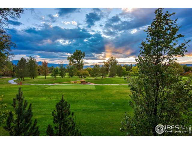 a view of a golf course with a lake