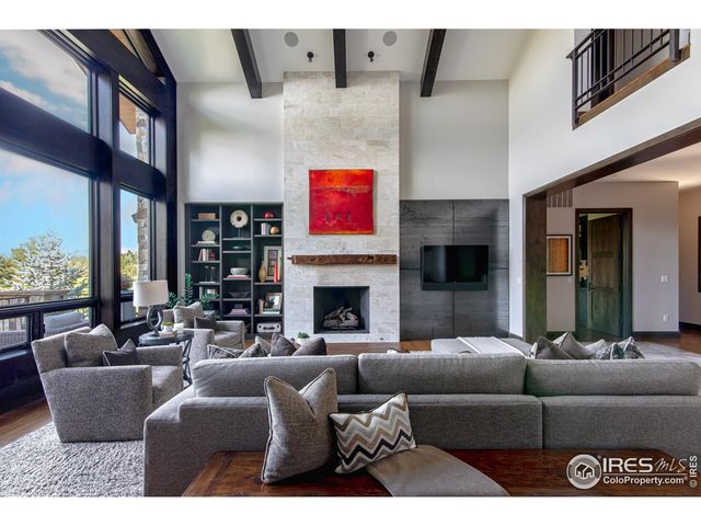 a living room with furniture window and a fireplace