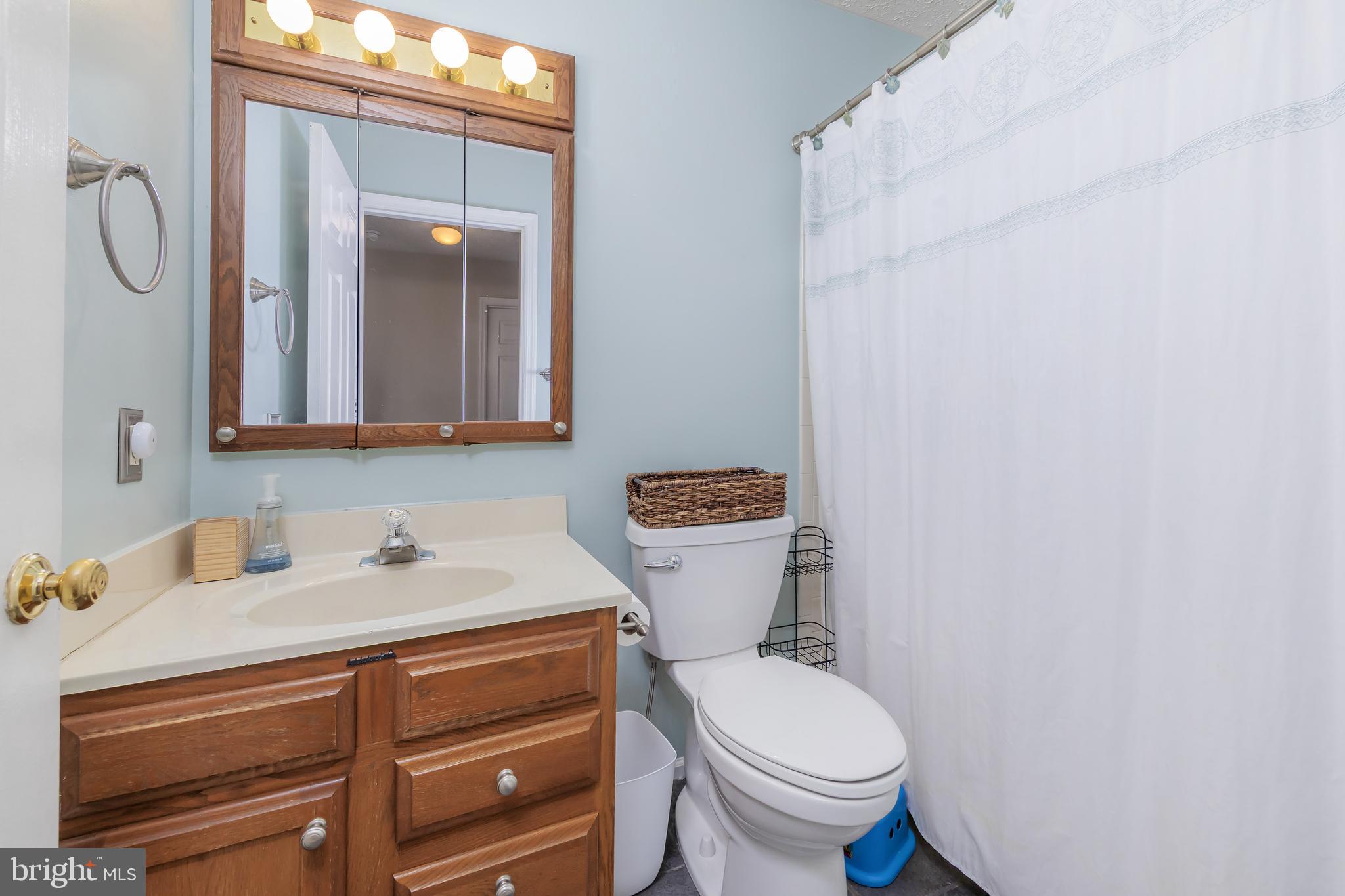 4 Ware Drive Glassboro, NJ 08028 - Photo 17 of 20 a bathroom with a toilet sink and mirror