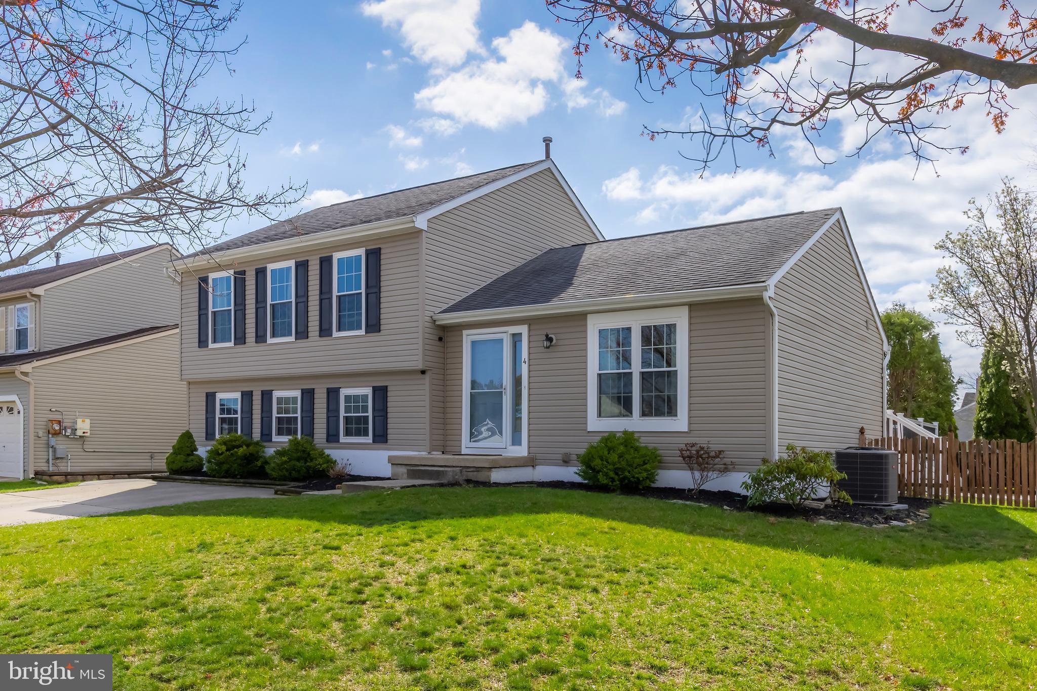 4 Ware Drive Glassboro, NJ 08028 - Photo 2 of 20 a front view of a house with garden