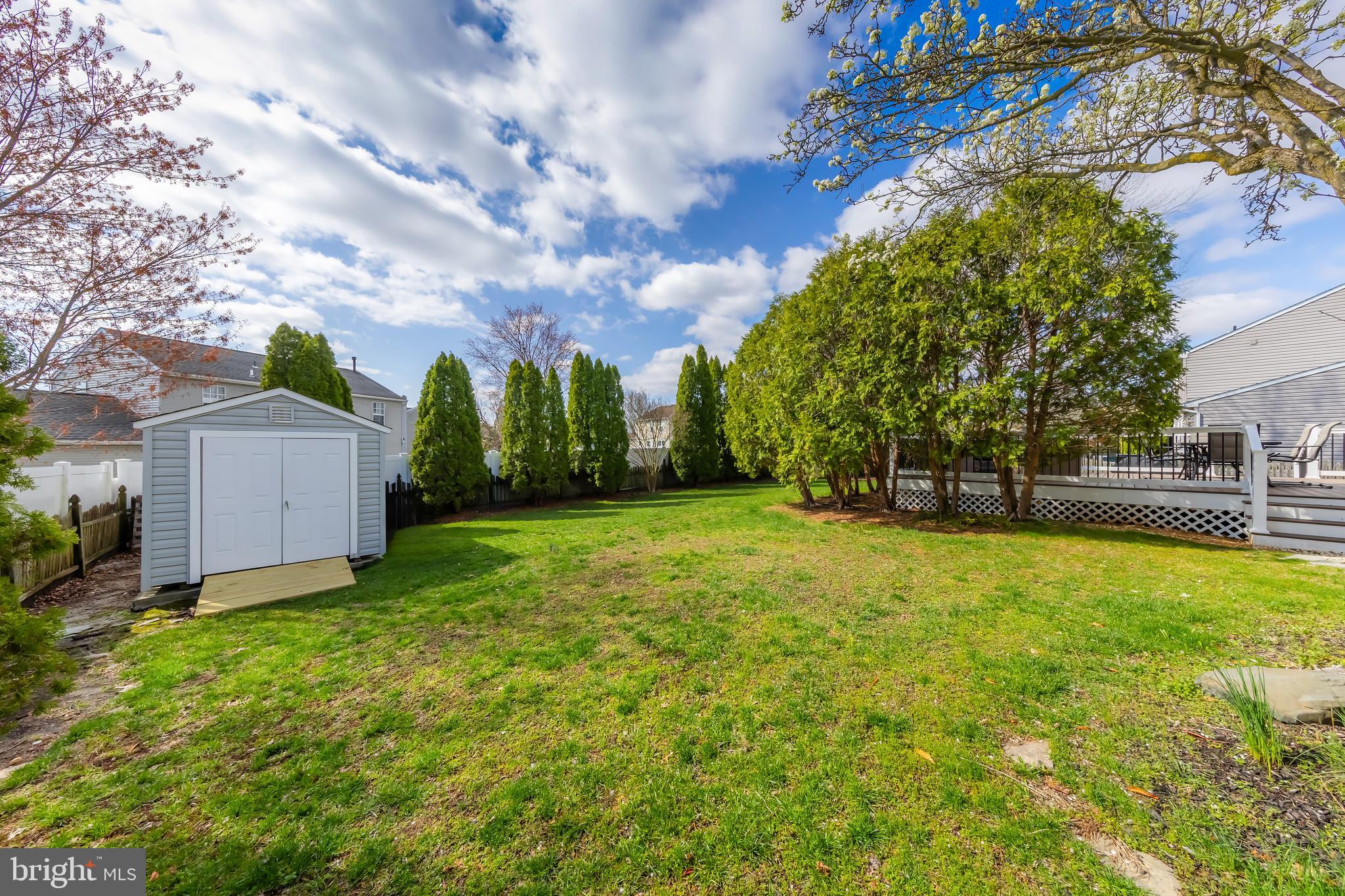 4 Ware Drive Glassboro, NJ 08028 - Photo 4 of 20 a view of a house with a large tree and a yard