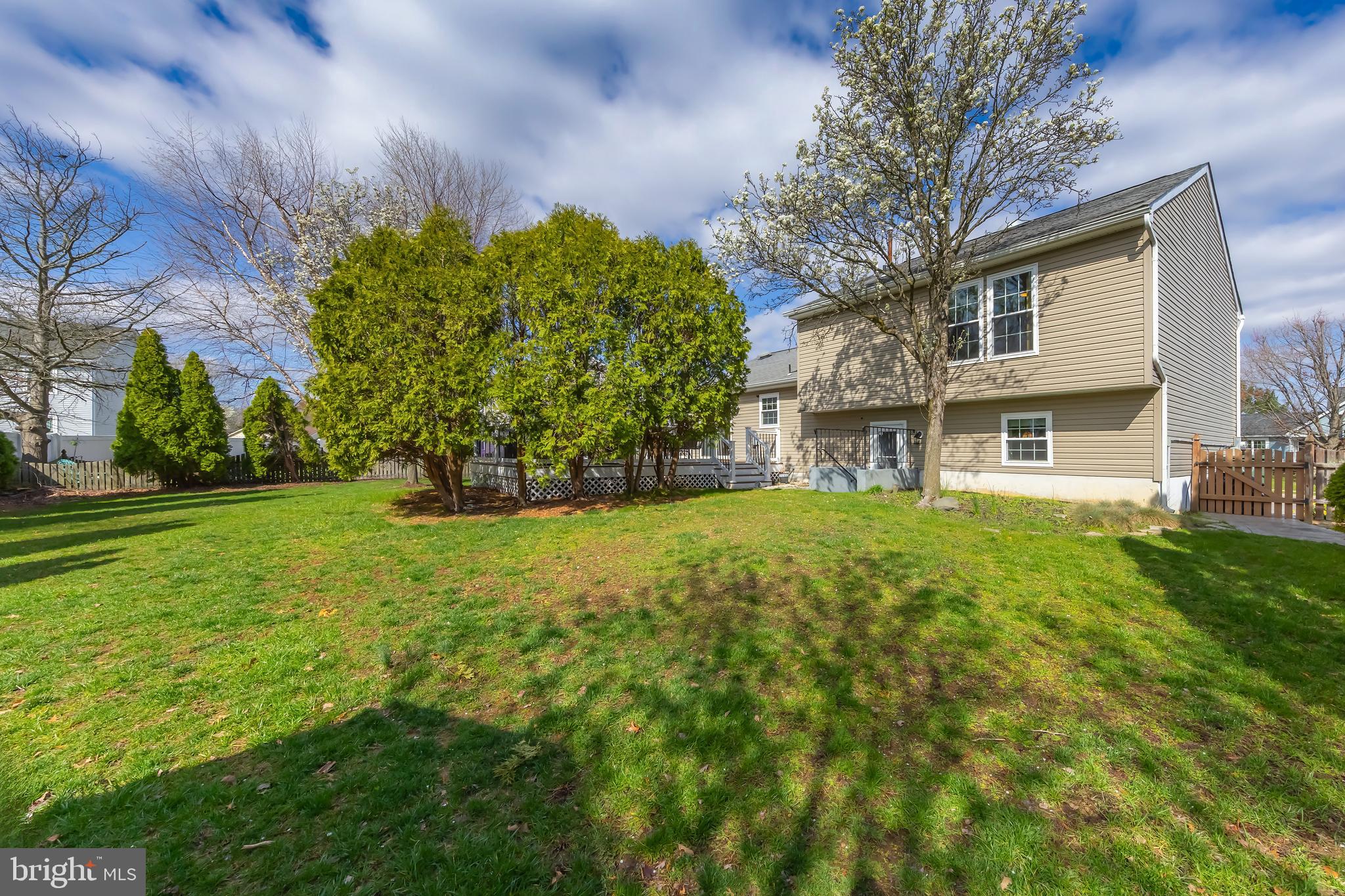 4 Ware Drive Glassboro, NJ 08028 - Photo 9 of 20 a front view of a house with garden
