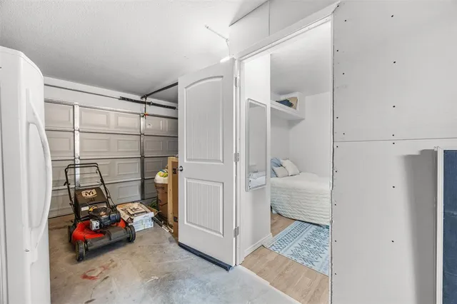 a view of a room with water heater and storage racks