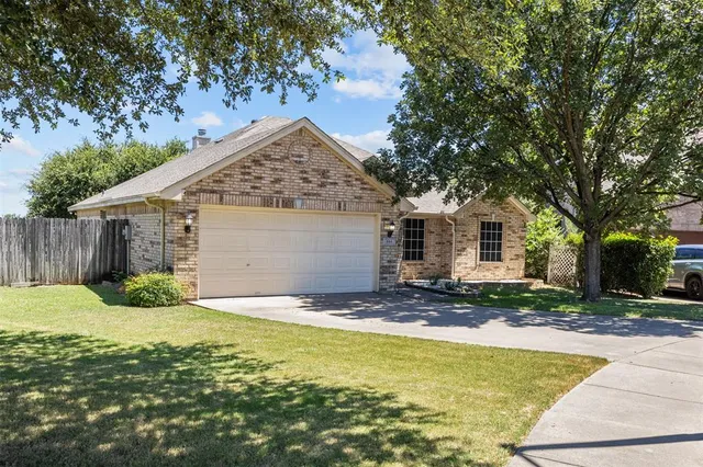 a view of a house with pool and a yard