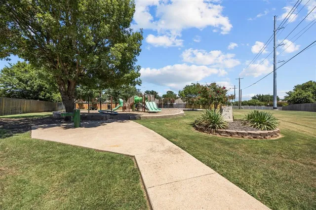 a view of a park with large trees