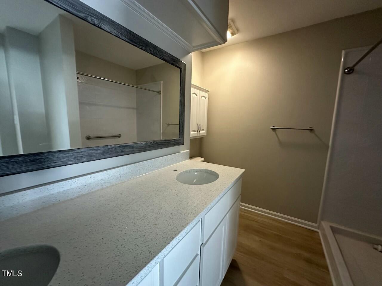 5400 Pine Top Circle Raleigh, NC 27612 - Photo 13 of 18 a bathroom with a sink and mirror