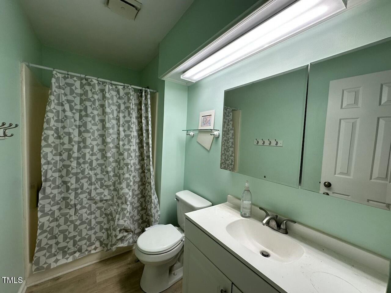 5400 Pine Top Circle Raleigh, NC 27612 - Photo 2 of 18 a bathroom with a sink toilet and shower