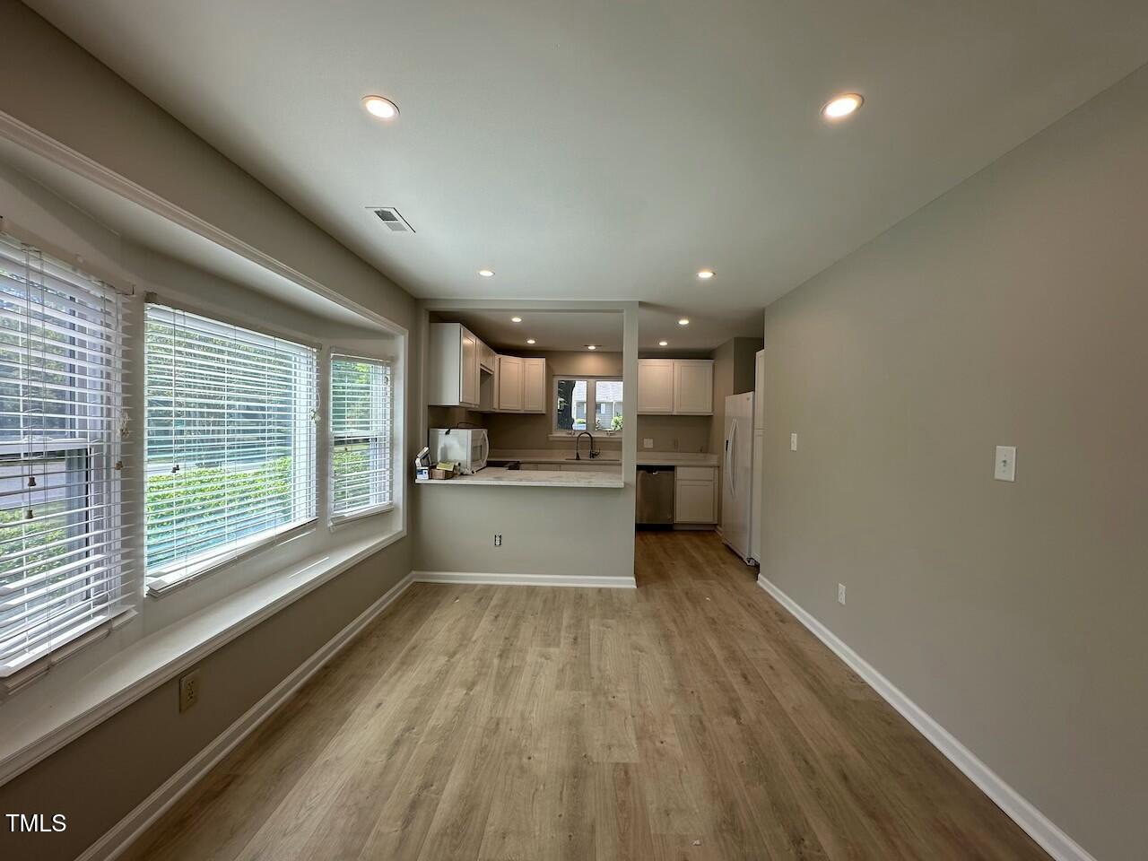 5400 Pine Top Circle Raleigh, NC 27612 - Photo 6 of 18 a view of kitchen with wooden floor