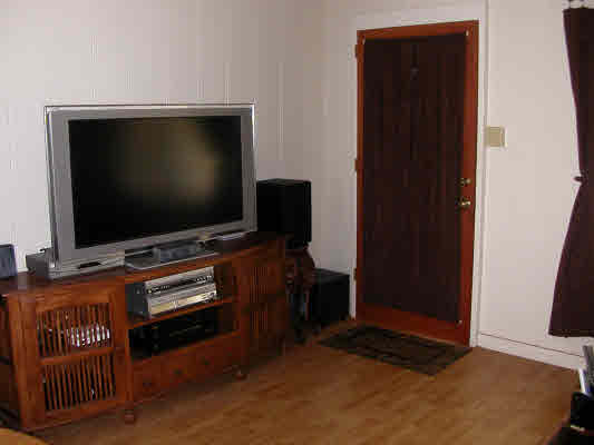 4896 Nunu Road Kapaa, HI 96746 - Photo 4 of 10 a living room with furniture and a flat screen tv