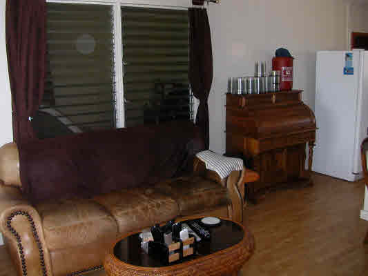 4896 Nunu Road Kapaa, HI 96746 - Photo 5 of 10 a living room with furniture and a fireplace