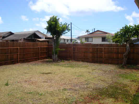 4896 Nunu Road Kapaa, HI 96746 - Photo 9 of 10 a small pool is sitting in the middle of a yard