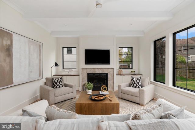 a view of an entryway with wooden floor and windows