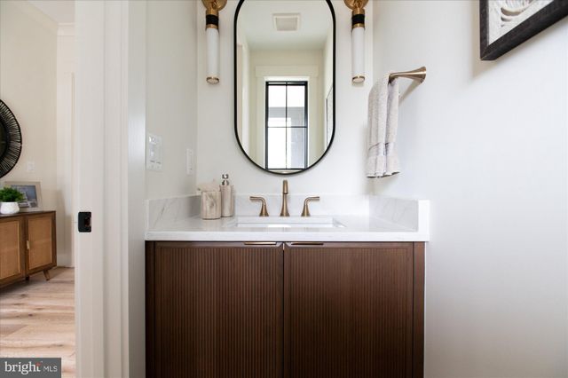 a kitchen with a refrigerator and a sink