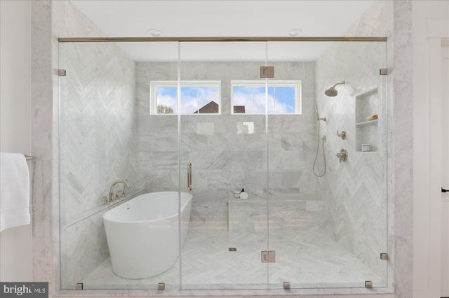 a bathroom with double vanity sinks and a mirror